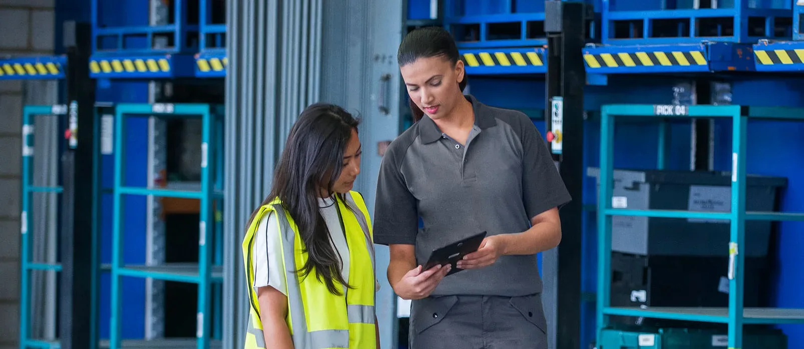 Two female workers in a industrial business room