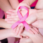 Hands Holding Pink Breast Cancer Ribbon