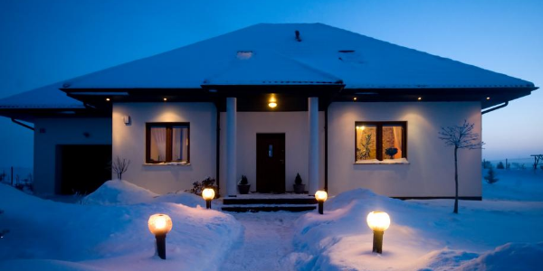 House in Winter with Snowfall