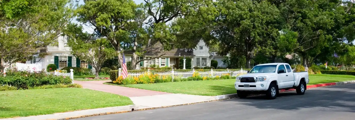 Residential street with colonial homes along the street - Keep pests away from your home with Suburban Exterminating in NY