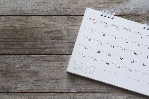 Blank calendar on wood background